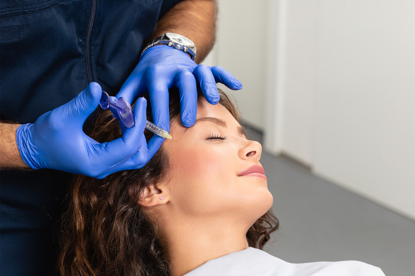 Image of a woman receiving cosmetic injections