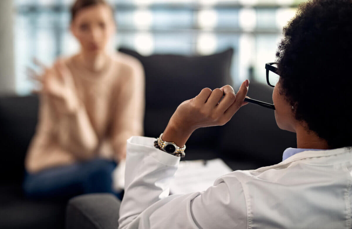 A psychologist sits in session with a patient