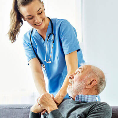 Nurse comforting an elderly patient