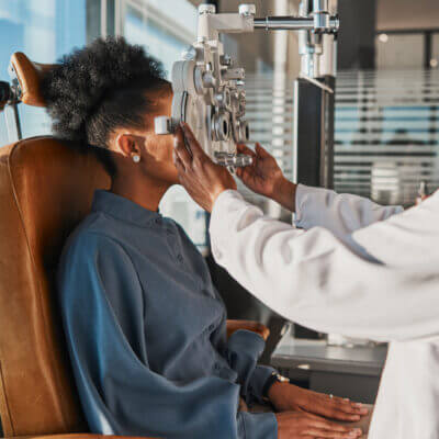 Young woman taking an eye exam