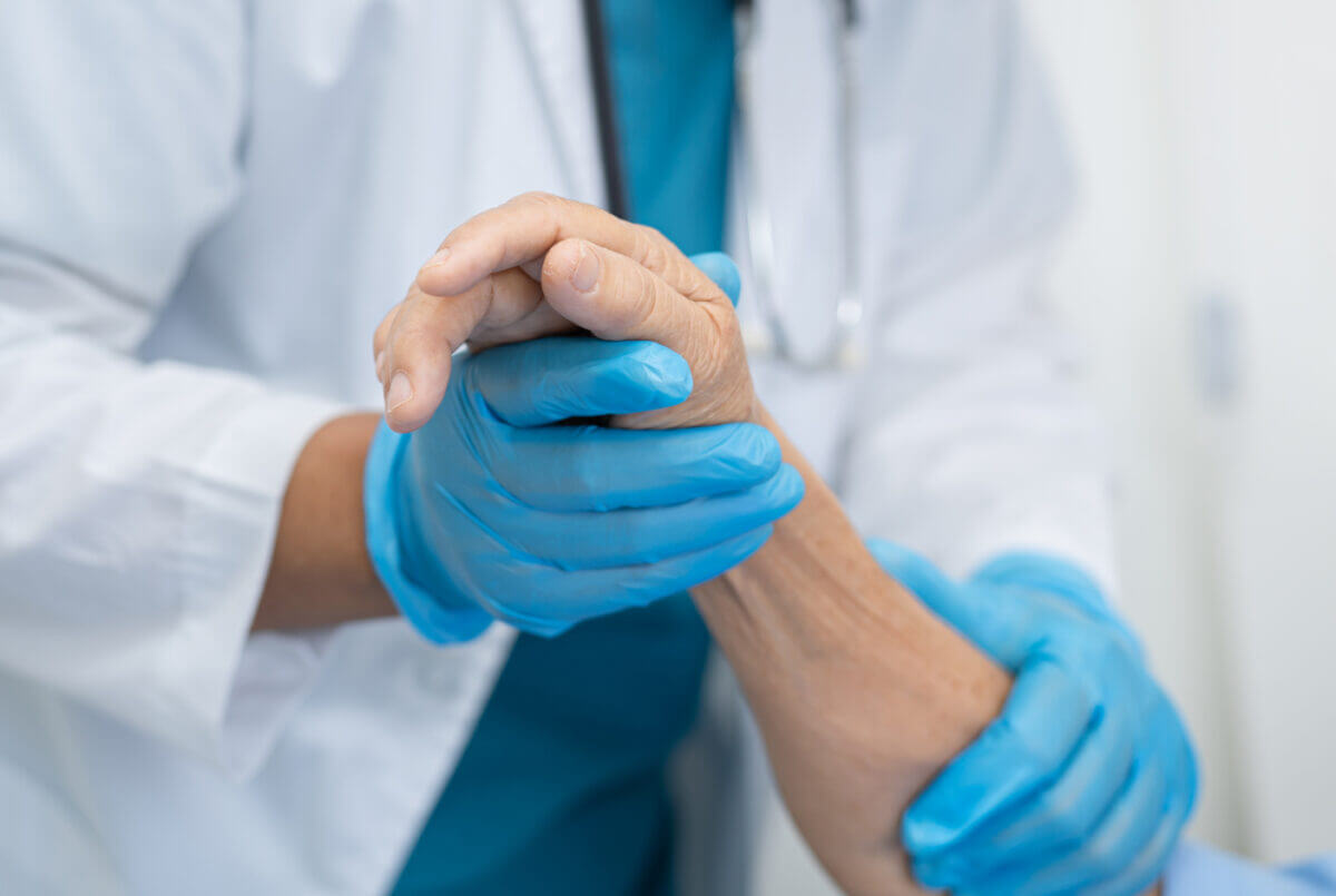 An orthopedic doctor examining a patient's hand