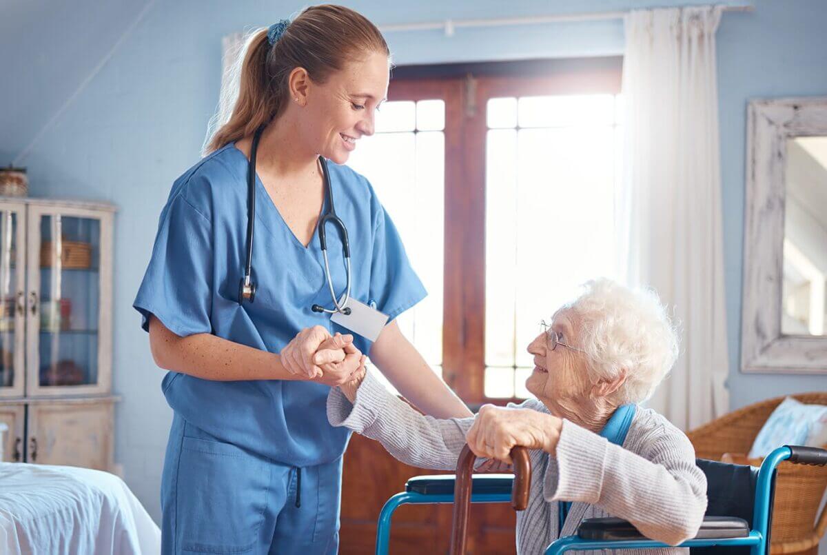 A nurse caregiver with a senior woman in her home